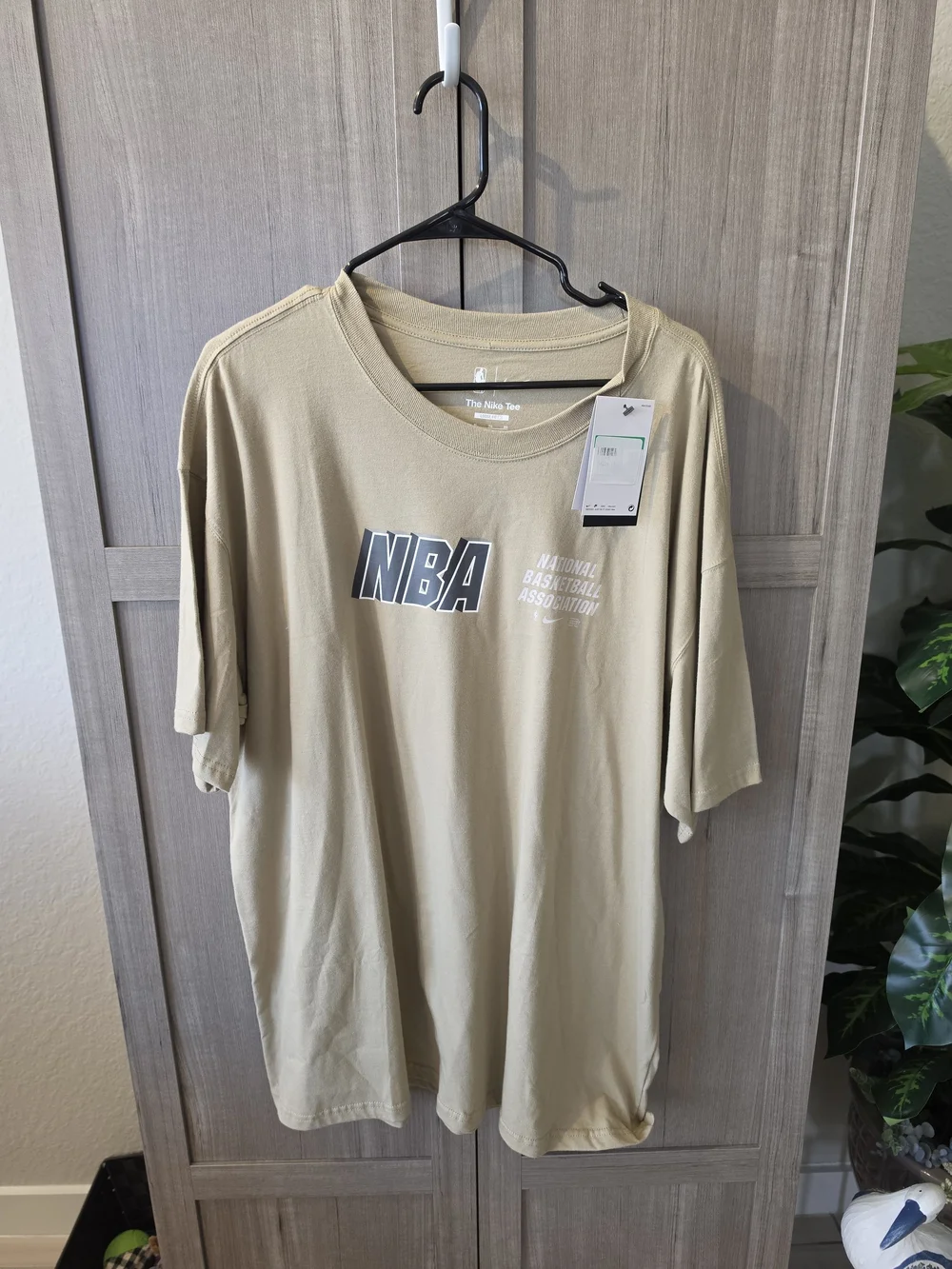 Nike NBA Short Sleeve Tee in Beige with Black Logo